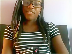 Black nerd with glasses masturbates with a hairbrush on her bed on skype