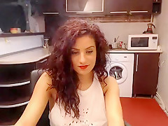 Curllynelly settled in the kitchen in front of webcam