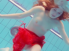 Red Dressed teen 18+ swimming with her eyes opened