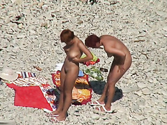 Two mature sluts naked on a beach